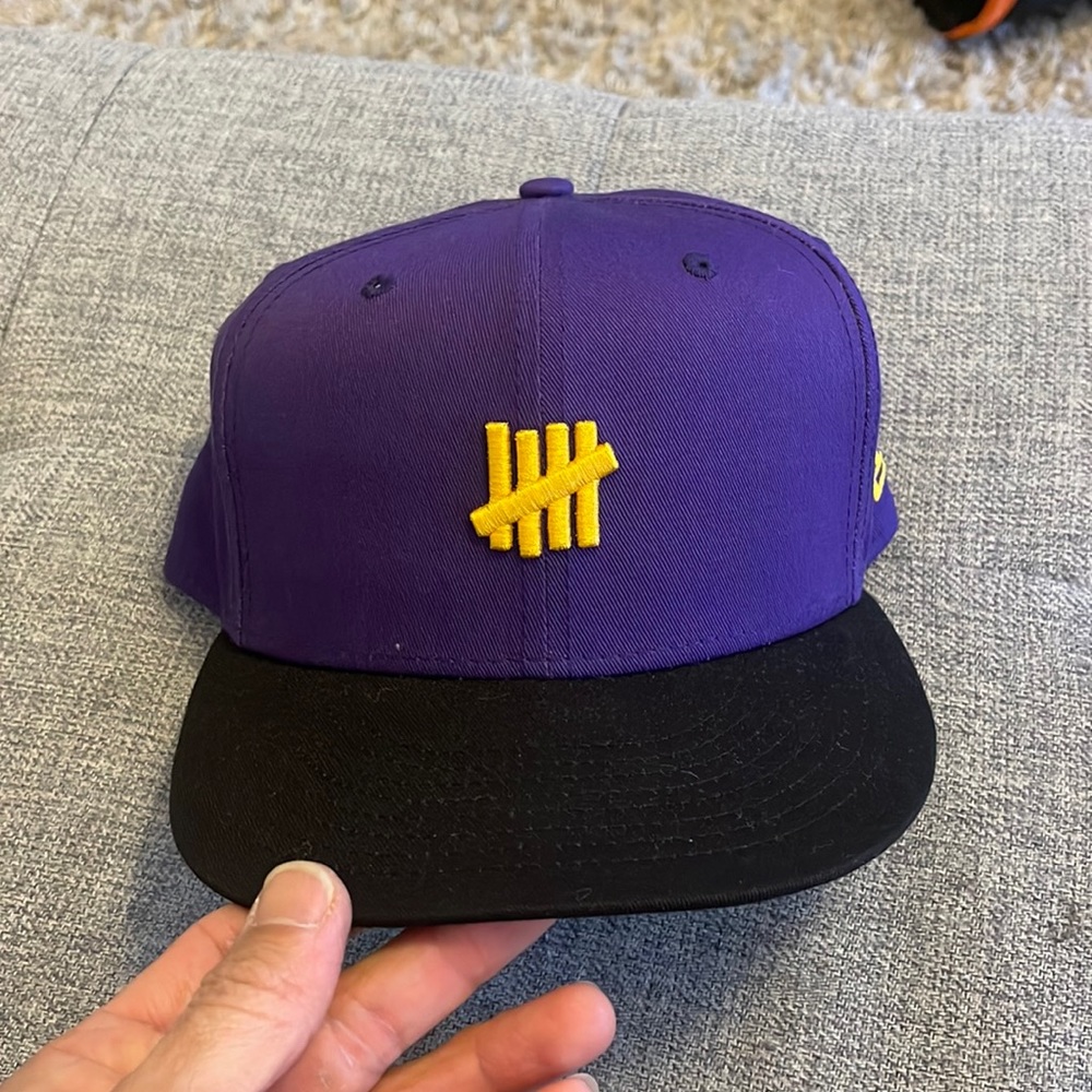 Undefeated purple/black snap back hat